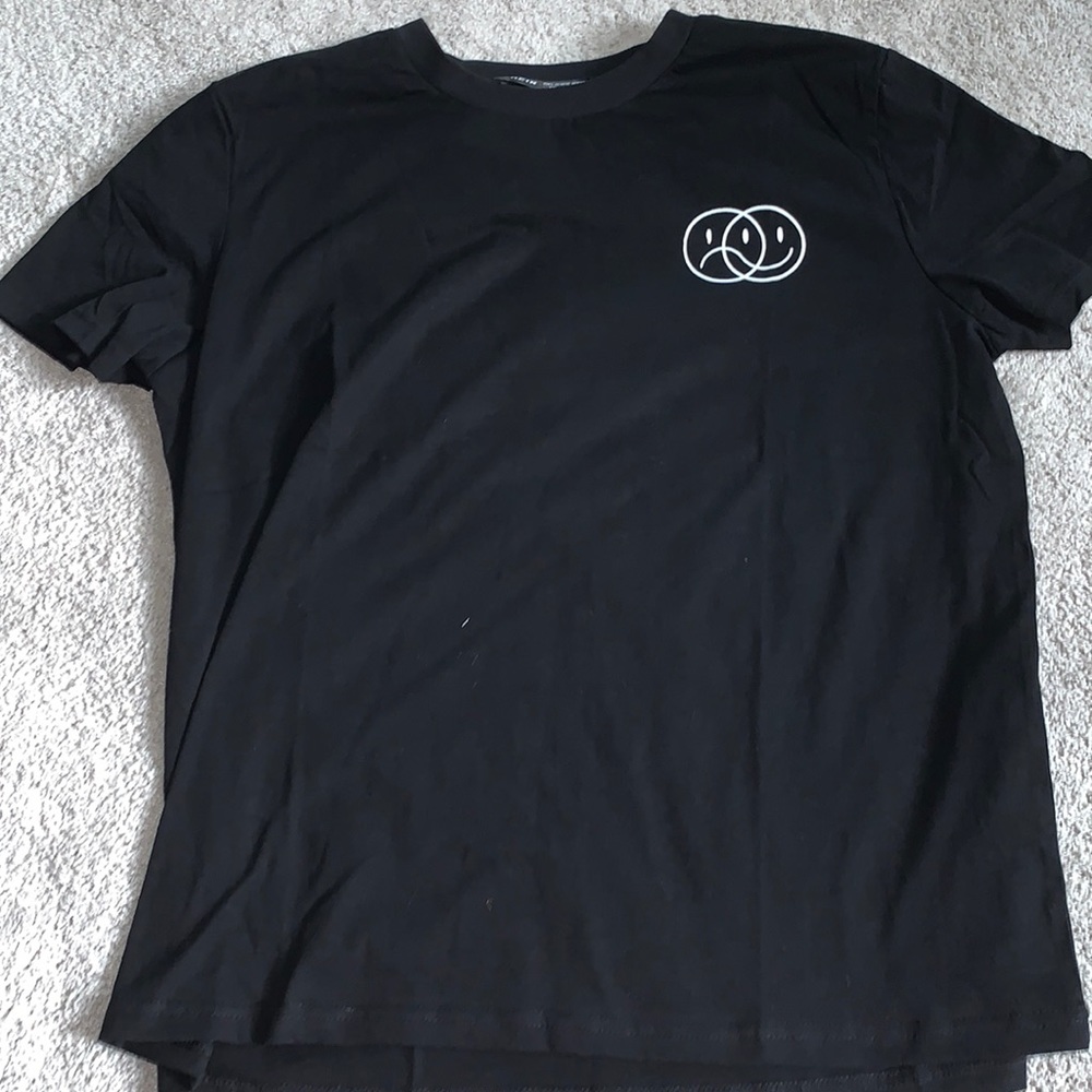 Black smiley/frowny face shirt